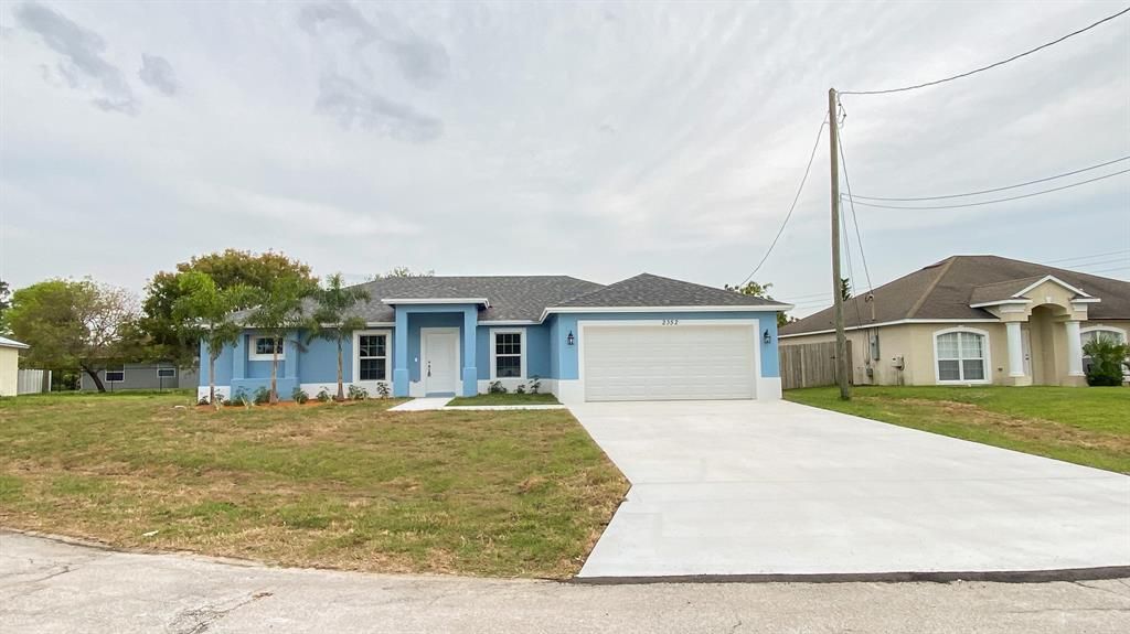 Photo of 1699 SE Grapeland Avenue, Port Saint Lucie, FL 34952 (MLS # R10819006)