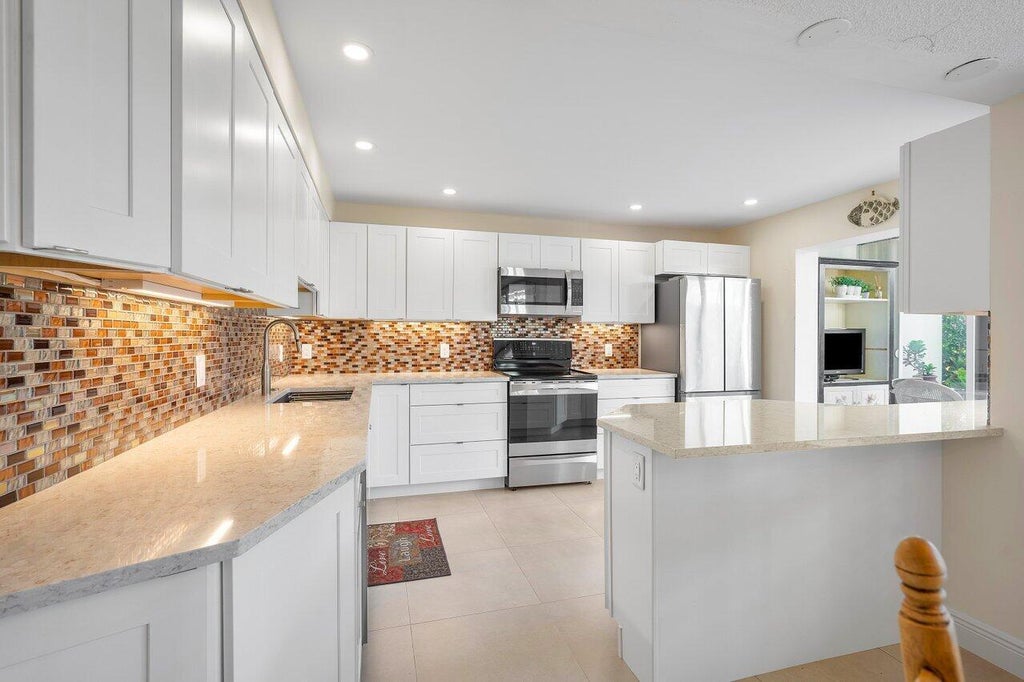 Photo of 3677 Quail Ridge Drive N #Bobwhite B, Boynton Beach, FL 33436 (MLS # B26079113)