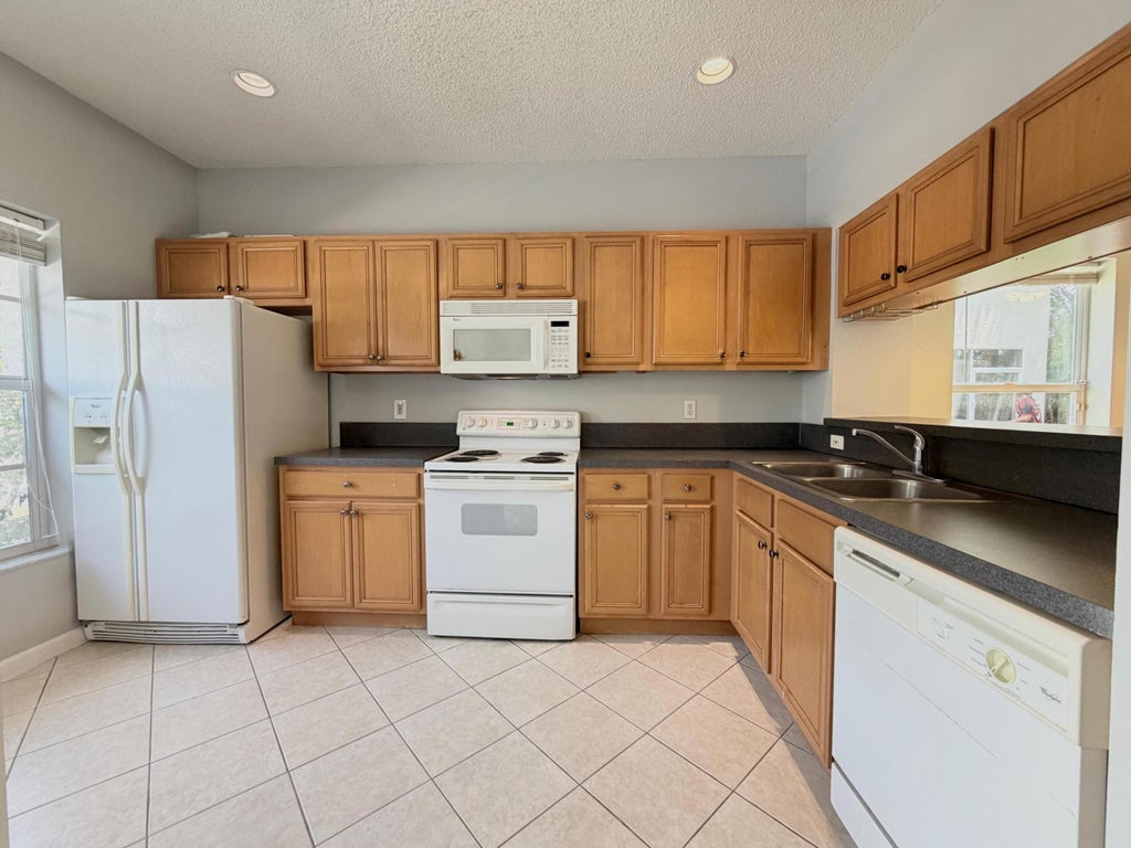 Photo of 5035 Palmbrooke Circle, West Palm Beach, FL 33417 (MLS # B26064948)