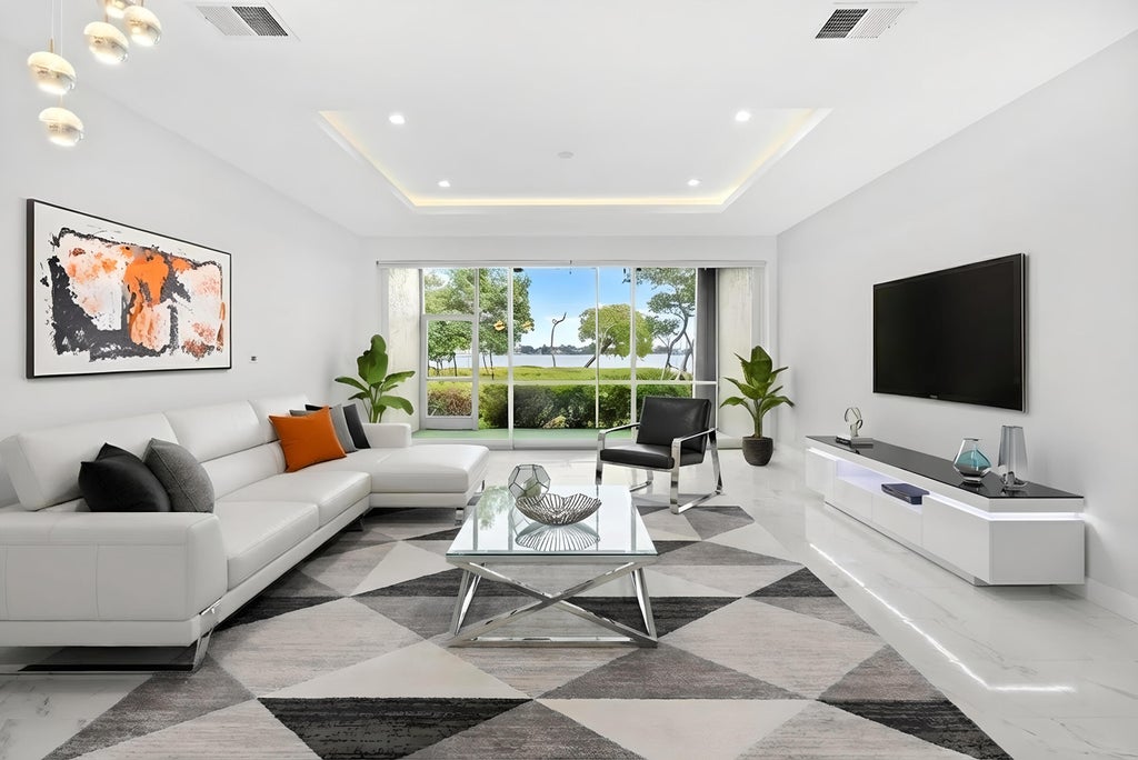 Photo of 88 N Lakeshore Drive, Hypoluxo, FL 33462 (MLS # B26077890)