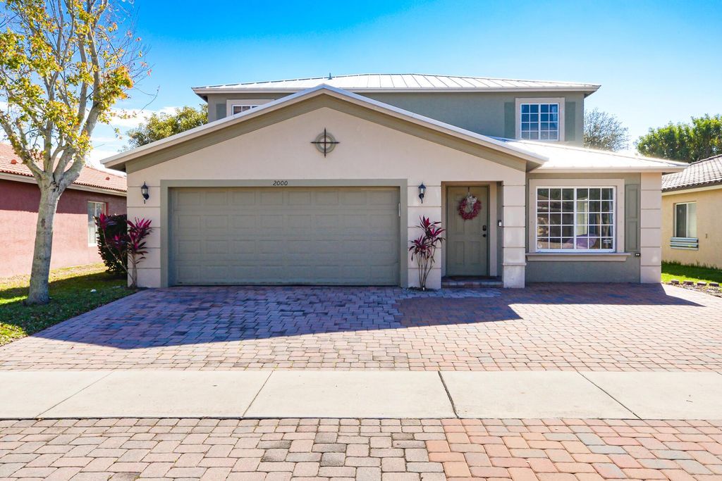 Photo of 2000 SW Marblehead Way, Port Saint Lucie, FL 34953 (MLS # R10952719)