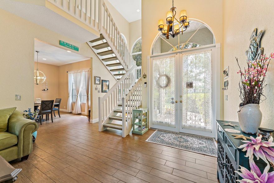 Tucked near the end of a cul-de-sac and surrounded by lush, mature landscaping, this beautifully maintained 3-bedroom, 3-bathroom home offers exceptional privacy and a thoughtfully designed layout. Welcome to The Moorings of Jupiter! The open-concept living spaces are filled with natural light and flow seamlessly to a large screened-in pool perfect for entertaining or enjoying relaxed weekends at home. The primary suite is conveniently located on the first floor and features plantation shutters, a spacious walk-in closet and a spa-like bathroom with a separate shower accented by a mosaic tile and a soaking tub. The main level showcases porcelain tile throughout, coastal backsplash in the kitchen, impact sliders, accordion hurricane shutters, outdoor lighting, a hurricane-rated garage door and one newer AC unit.  Upstairs, you'll find two generously sized bedrooms, a fully remodeled bathroom and a versatile loft area. The second floor also offers direct access to a private deck overlooking the backyard and pool. Meticulously renovated and lovingly cared for, this home truly must be seen to be appreciated.  Ideally located minutes from beaches, dining, shopping and top-rated schools, this inviting retreat delivers everyday convenience alongside serene privacy.