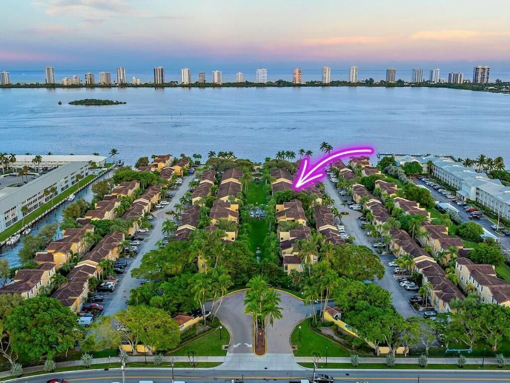Photo of 1045 Lake Shore Drive #104, Lake Park, FL 33403 (MLS # R11043597)
