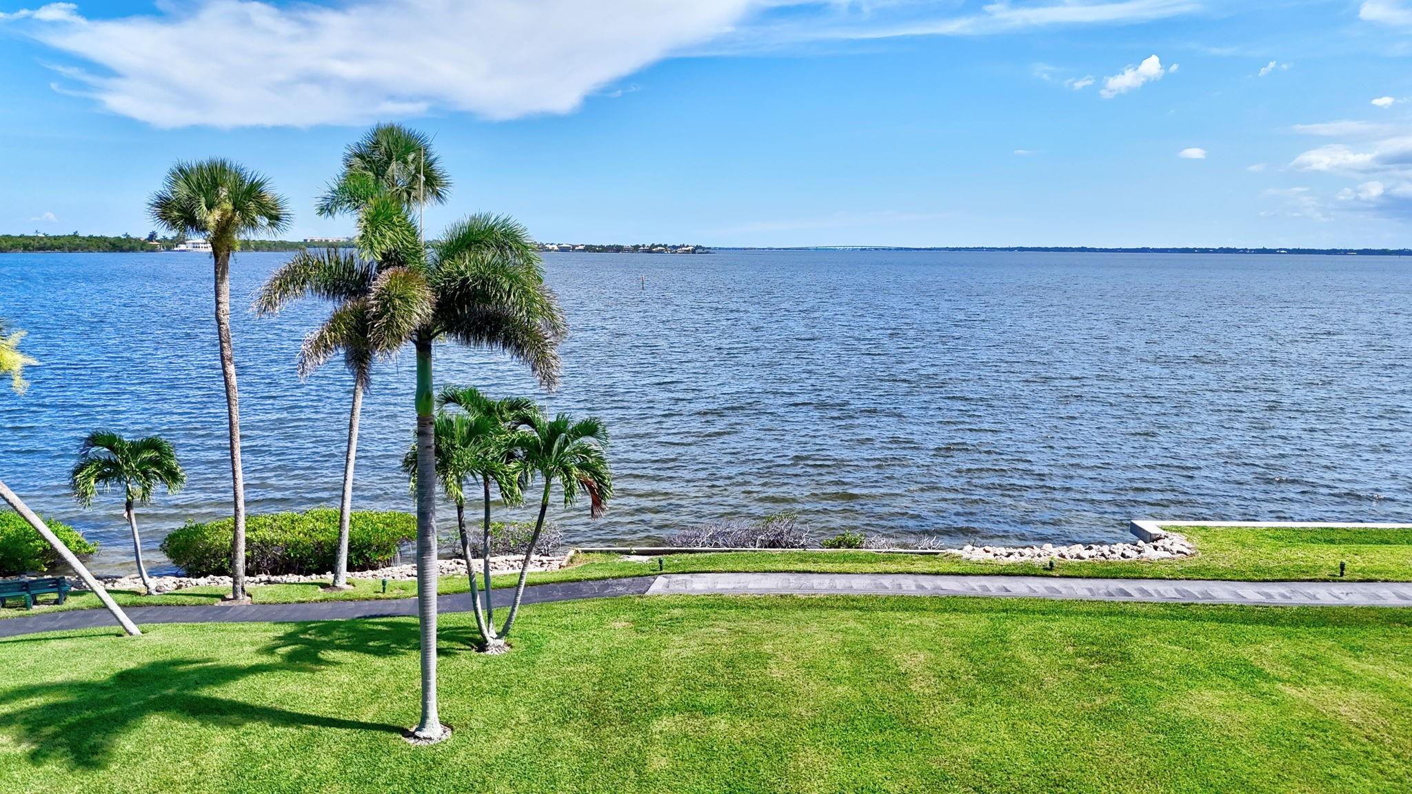 Direct Waterfront! Must see this 2 bedroom 2 Bath unit in Jensen Beach on the Riverside. Only 1/2 mile walk or 2 minute drive to beach. Picture yourself entertaining your family and friends with gorgeous full views of the River. Water views from the front door straight through the dining room, Livingroom and both bedrooms. Impact Sliders. Community has 2 pools, pickle ball and Tennis, Club house, Fitness room, and car ports to keep your car cooler. There is an elevator available as well as a community storage room in each building. Walkway and benches on the water front around the community. Pet and Pick up trucks accepted.