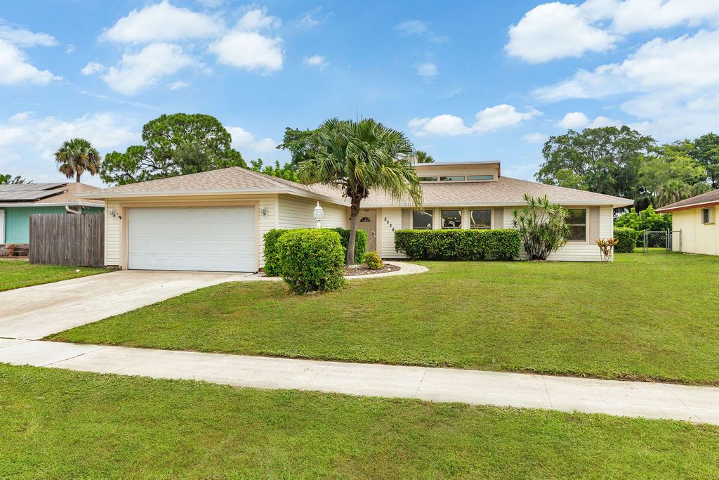 Photo of 2558 Canterbury Drive S, Riviera Beach, FL 33407 (MLS # R11096807)