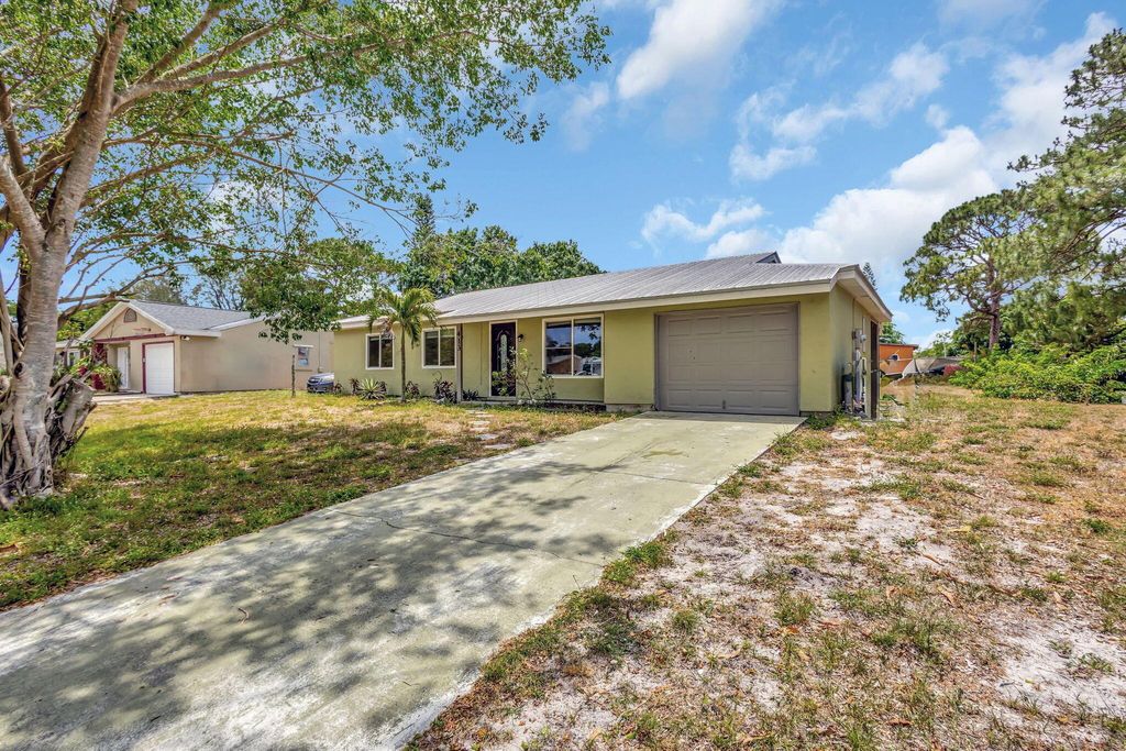 Photo of 413 SW Kentwood Road, Port Saint Lucie, FL 34953 (MLS # R11087743)