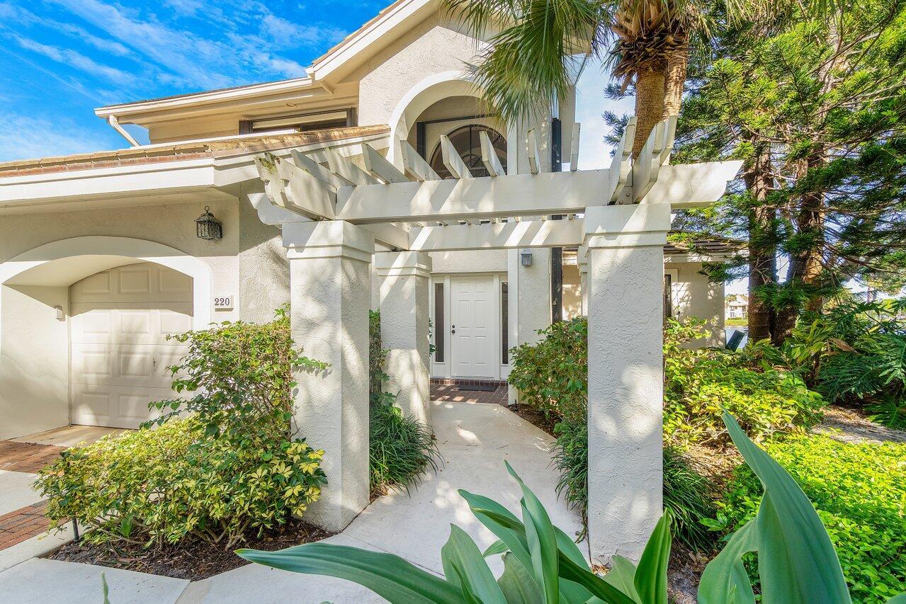 Exceptional opportunity to enjoy one of the best water and golf views in Jonathan's Landing. Designer decor, pristine condition, SE exposure. End unit insures additional privacy. West Bay offers residents a resort style community pool.
