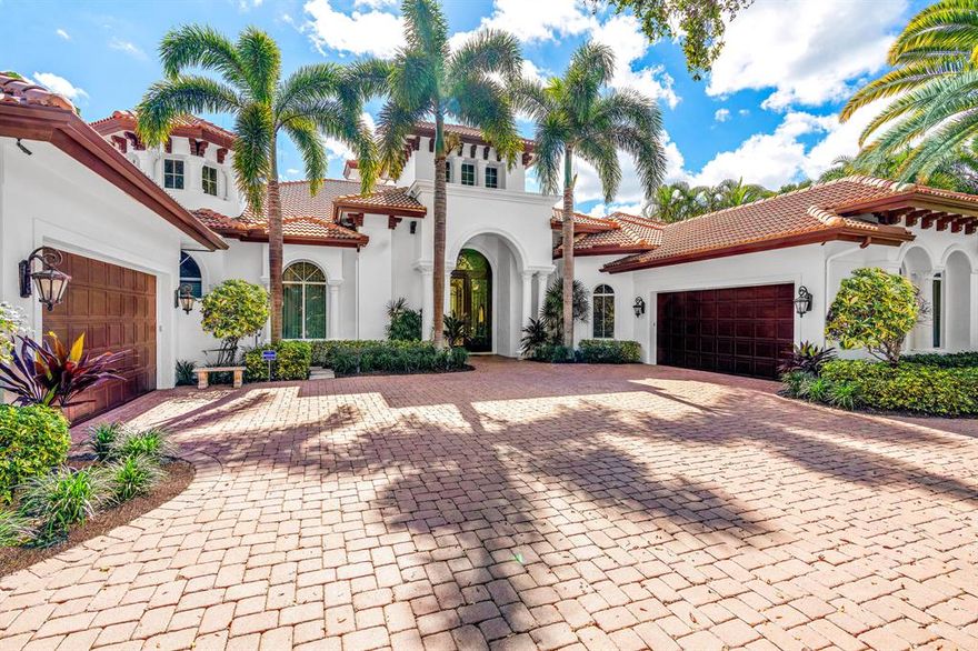 NO MEMBERSHIP REQUIRED! This home has been freshly painted on the exterior. 4 bedrooms each with private bath, which includes a cabana guest suite, granite & wood kitchen, stone floors, custom wood moldings, fireplace, home theater, executive study, lavish master suite with his/her baths & closets, and private exercise room. Bring your boat to the protected dock that will accommodate a boat up to 70'. Relax in the resort style pool complete with waterfall and rock spa. Offered fully furnished. This home allows you to take advantage of several membership options in one of the most prestigious Golf and Boating Communities in South Florida. All sizes and measurements are deemed reliable but not guaranteed.