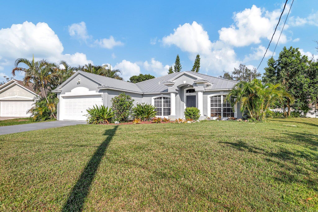Photo of 2091 SW Bellevue Avenue, Port Saint Lucie, FL 34953 (MLS # R11029327)