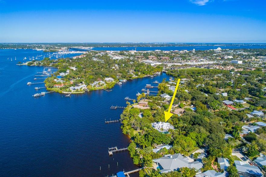 Discover the timeless elegance of this Victorian Masterpiece! This Majestic 1 acre+ waterfront property offers over 260 feet of wide water frontage with commanding views of the St. Lucie River, PLUS+ the opportunity exists to divide the property into 2 direct wide waterfront parcels!! The lush beautiful & naturally landscaped gardens, private pool area with ''Grotto'', wrap-around porch/deck + a Canopy of Trees are perfect places to relax or entertain with family & friends. The Large 3+ Car detached garage also has an attached Guest Cottage with kitchenette/bedroom/bathroom & private viewing deck to the river. Nostalgia & a Bygone era best describes the Interior Architectural features of this special home.Owner will consider Seller Financing with 50% down, 6% APR with a 5 Year Term