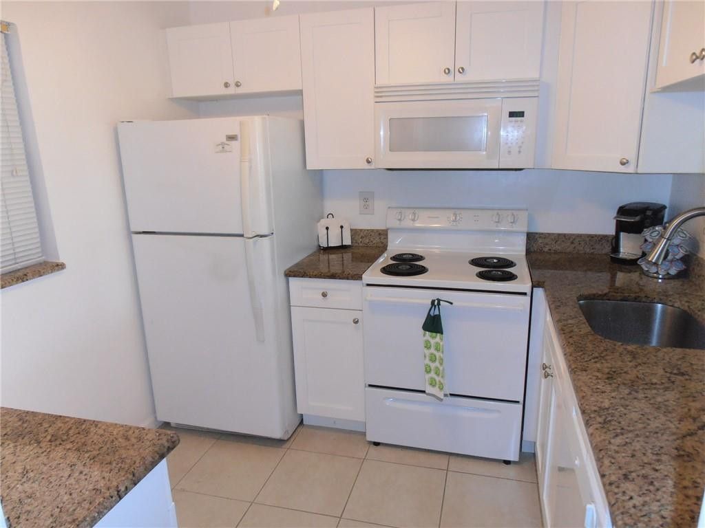 Photo of 9460 Poinciana Place #101, Davie, FL 33324 (MLS # B26036551)