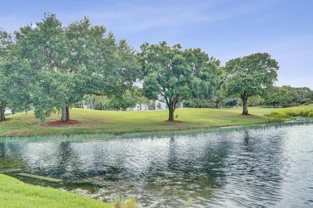 Photo of 9460 Poinciana Place #101, Davie, FL 33324 (MLS # B26036551)