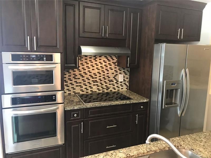 Beautiful 2/2 CONDO IN EXTRAORDINARY CONDITION!!, THIS SPACIOUS (1200 SQ FT) CORNER
UNIT HAS BEEN FULLY RENOVATED WITH 24"CERAMIC TILE, DARK WOOD KITCHEN CABINETS, GRANITE & TOP
OF THE LINE STAINLESS APPLIANCES. FULLY REMODELED BATHROOMS, LARGE BEDROOMS WITH DOUBLE
WALK-IN CLOSETS, LAUNDRY AREA WITH FULL SIZE WASHER/DRYER, STORAGE & REAR PATIO.
VERY CLOSE TO COMMUNITY FITNESS CENTER, POOL & SPA. WALKING DISTANCE TO CORAL SQUARE MALL,
MOVIES & RESTAURANTS. A+ SCHOOL DISTRICT. 2 PARKING SPACES!!