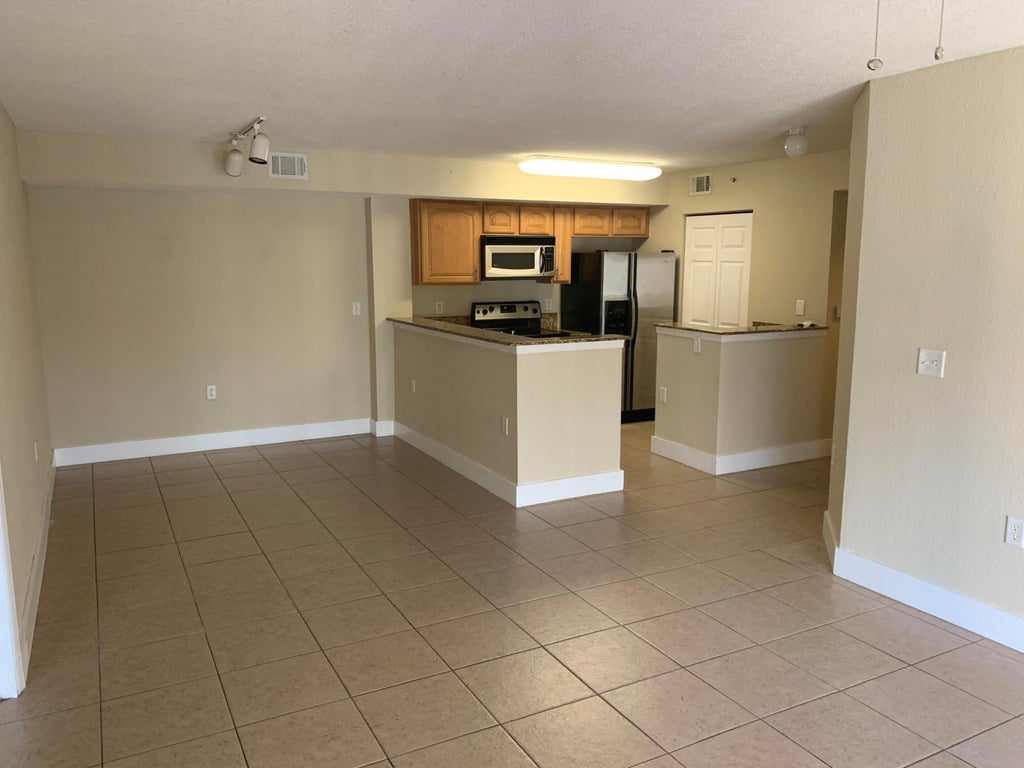 Photo of 241 SW Palm Drive #107, Port Saint Lucie, FL 34986 (MLS # B26055955)