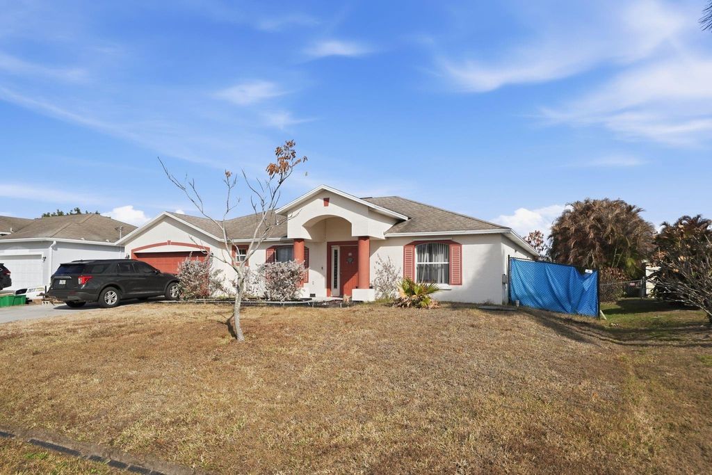 Photo of 721 NW Treemont Avenue, Port Saint Lucie, FL 34983 (MLS # F10554772)