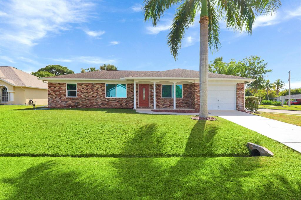 Photo of 302 SE Lancaster Avenue, Port St Lucie, FL 34984 (MLS # R10932549)