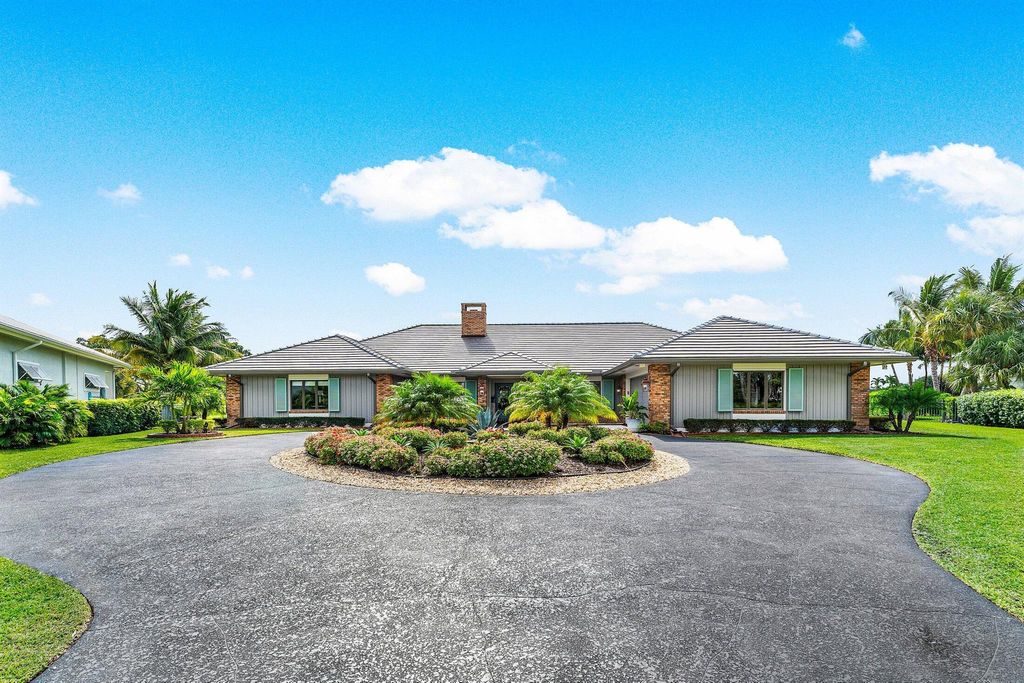 Photo of 427 Glenbrook Drive, Atlantis, FL 33462 (MLS # R11135211)