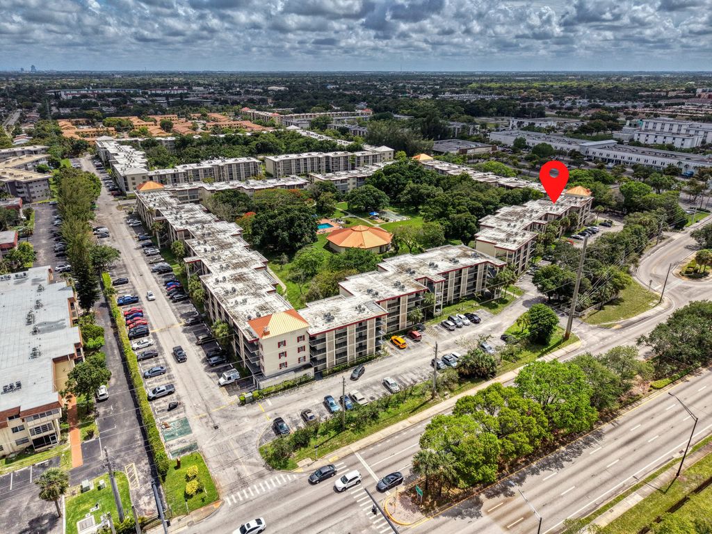 Photo of 3070 NW 48th Terrace #405, Lauderdale Lakes, FL 33313 (MLS # B26038589)
