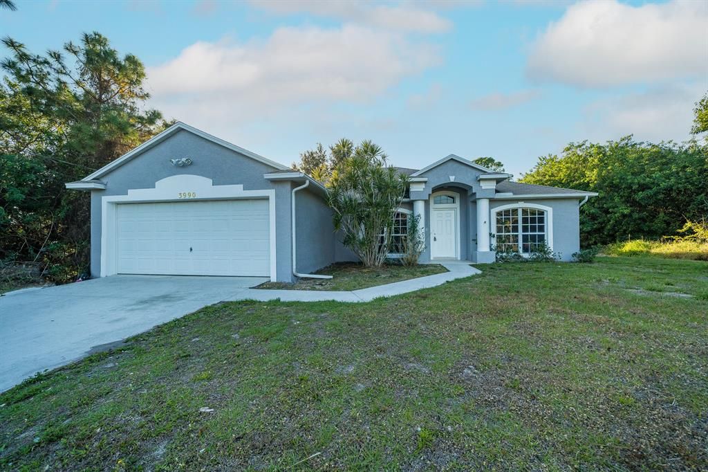 Photo of 3990 SW Halcomb Street, Port Saint Lucie, FL 34953 (MLS # R10774794)