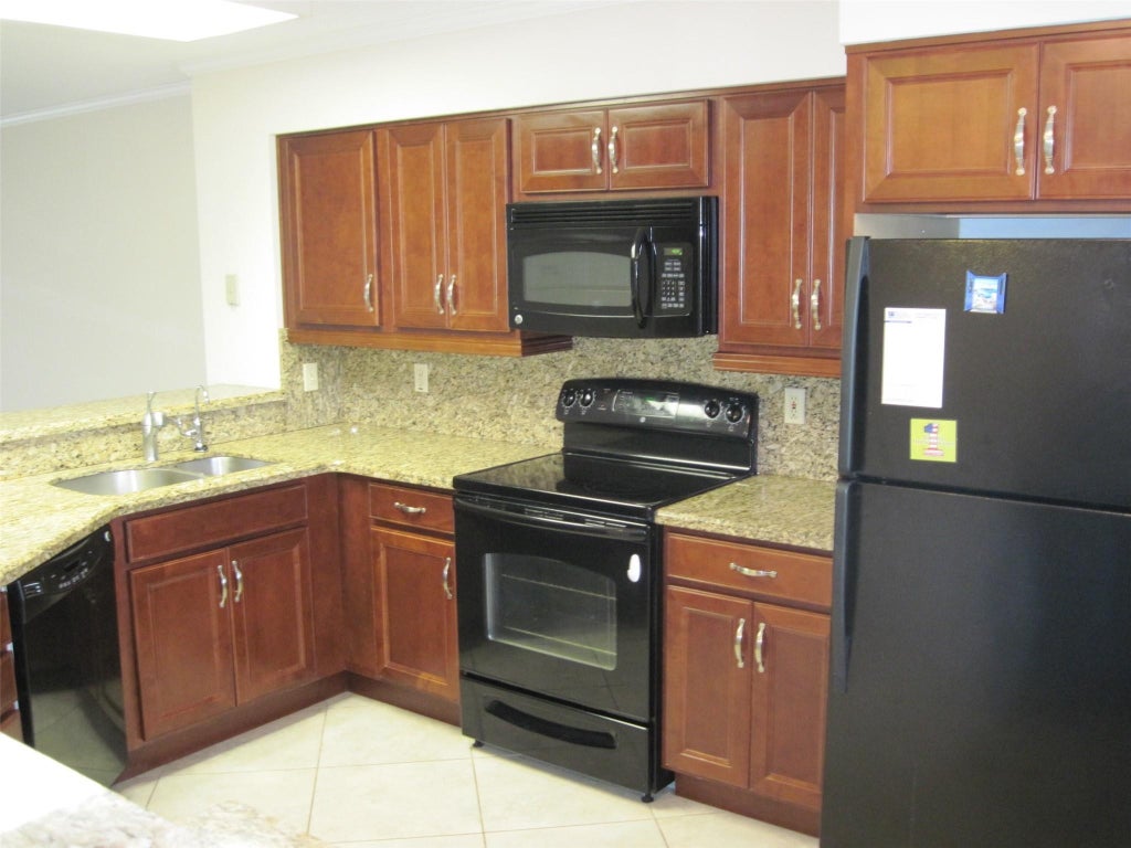 Photo of 2232 N CYPRESS BEND Drive #307, Pompano Beach, FL 33069 (MLS # B26072844)