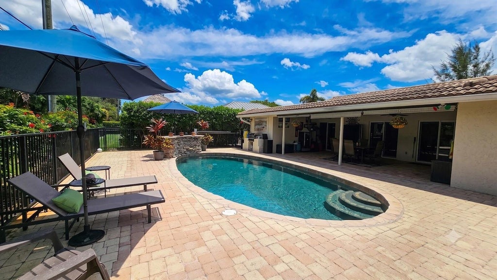 Photo of 244 Walton-Heath Drive, Atlantis, FL 33462 (MLS # B26057659)