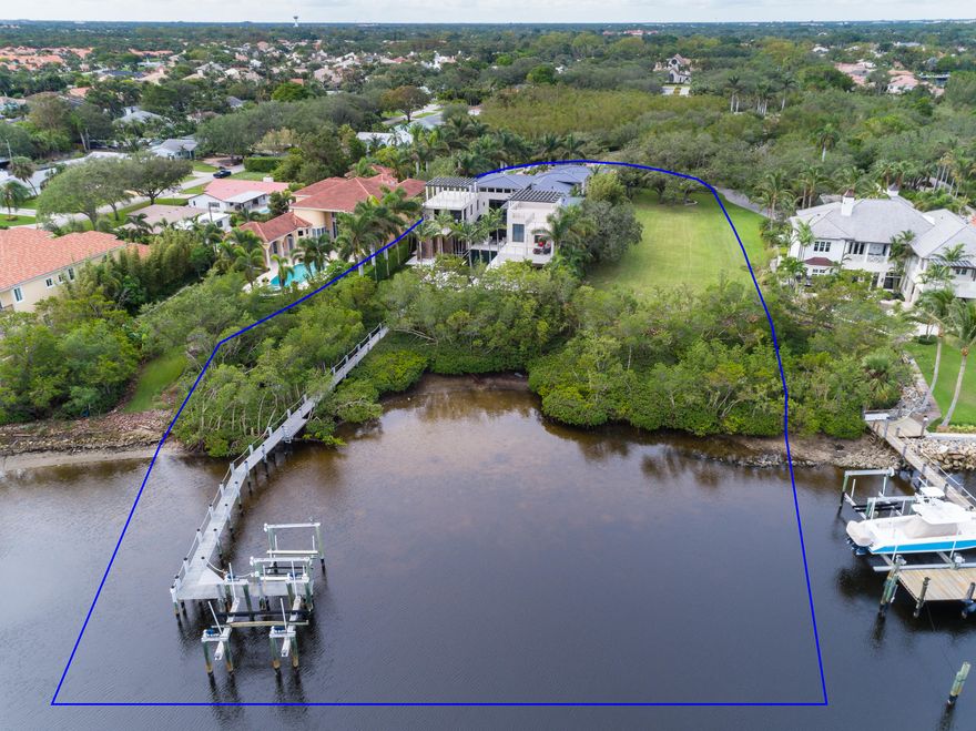 This amazing Waterfront Estate is being sold WITH THE ADJACENT WATERFRONT HOMESITE! It is already cleared and ready for a house, tennis court, indoor workout facility or may be sold off for top dollar as there are virtually no waterfront homesites available, especially in a location as desirable as this one. This home and surrounding property is amazing! There are over 10,000 sq/ft. of pristine, clean, contemporary splendorous indoor living within this home built in 2010. Although the house shows as if it were brand new. It's fabulous!This contemporary home is large but lives very comfortably thanks to the well thought out design.