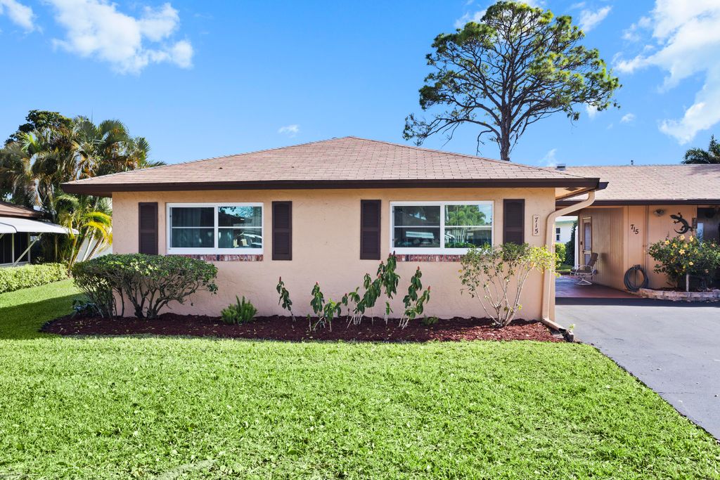 Photo of 715 Whippoorwill Lane, Delray Beach, FL 33445 (MLS # R11165356)