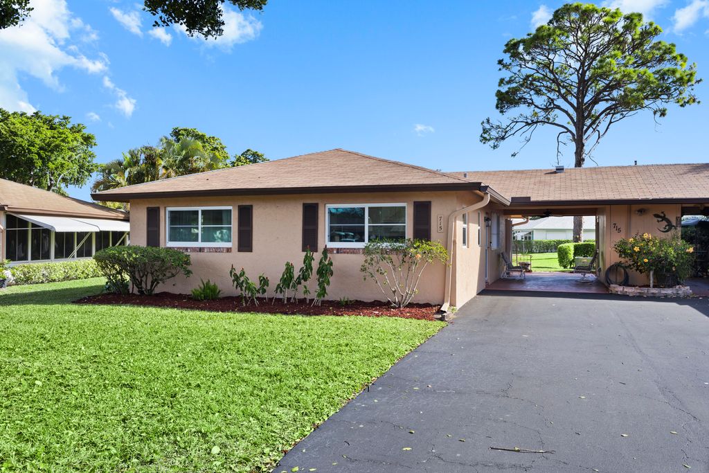 Photo of 715 Whippoorwill Lane, Delray Beach, FL 33445 (MLS # R11165356)