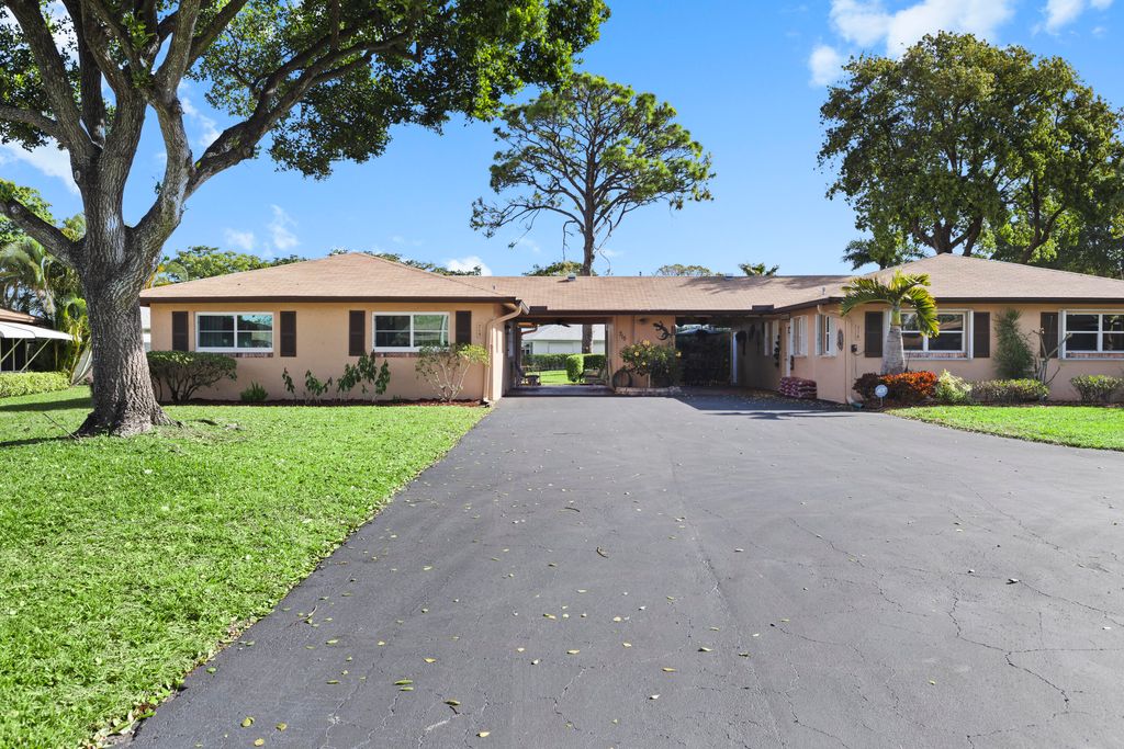 Photo of 715 Whippoorwill Lane, Delray Beach, FL 33445 (MLS # R11165356)