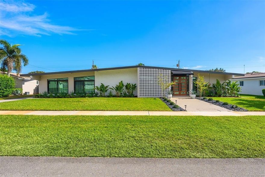 Welcome to this impeccable mid-century move-in ready modern gem in highly desirable Hollywood Hills. Every detail of this spacious home adds character and charm, and exudes sophistication, with impeccable attention to detail, creating a space that feels effortlessly luxurious. A bright, open layout features natural light, large windows, vaulted ceilings, and stylish finishes that embody mid-century design, blending timeless architecture with modern upgrades. Recent upgrades include two new AC units (2024) with updated ductwork, partial impact windows, a reinforced impact door, a saltwater heated pool, an outdoor shower, turf and a whole-house water softener with reverse osmosis filtration. This home offers style, function, and peace of mind in a prime South Florida location.