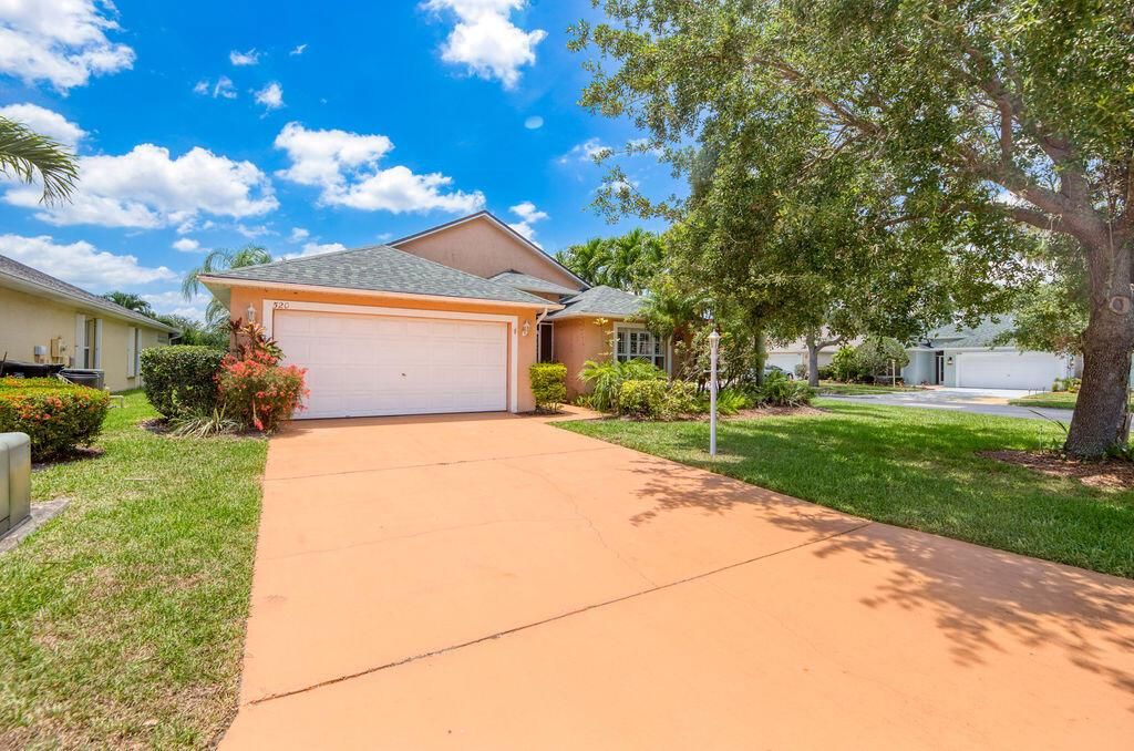 Photo of 520 SW Cyrilla Trail, Port Saint Lucie, FL 34953 (MLS # R11092239)