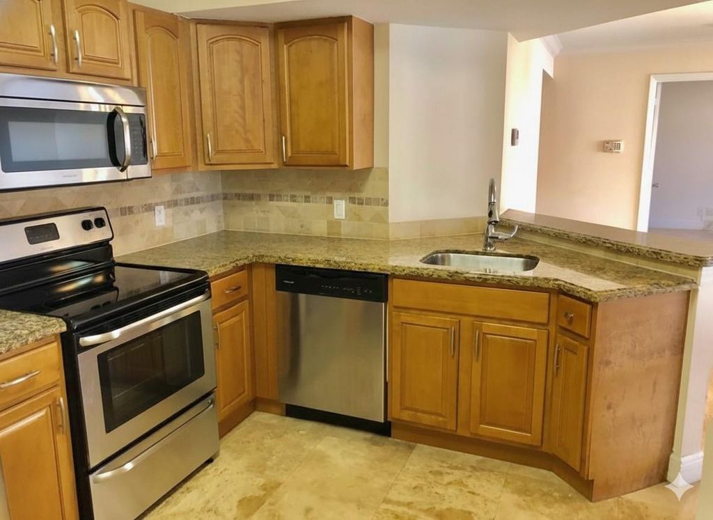 Photo of 8721 Wiles Road #104, Coral Springs, FL 33067 (MLS # F10550482)