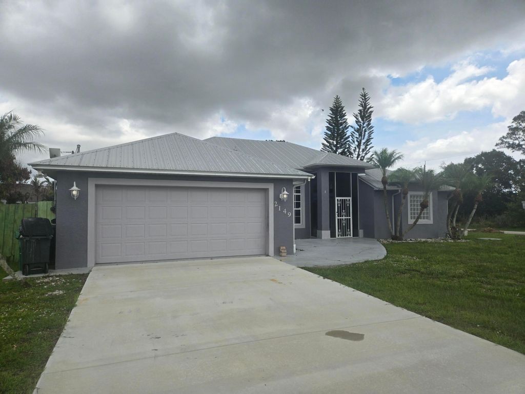 Photo of 2149 SW Savage Boulevard, Port Saint Lucie, FL 34953 (MLS # B26035393)