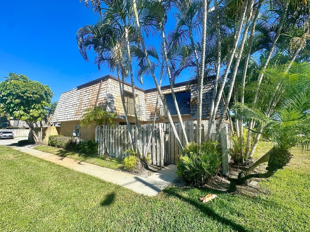 Photo of 225 Lake Arbor Drive, Palm Springs, FL 33461 (MLS # R11150732)