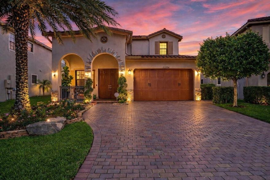 Parkland Reserve Grande Model offering 5 bedrooms plus a spacious loft and 3.5 baths with over $50,000 in builder upgrades. This newer-construction home features impact windows and doors, primary bedroom on first floor, custom built-in closets, decorative wall molding, and wood-style flooring throughout the entire second floor and stairway. All bathrooms have been updated with custom vanities, and the seller has recently installed two brand-new A/C units. The backyard is truly exceptional—larger than most homes and among the largest in the community, offering a rare sense of space, openness and privacy. Professionally landscaped front & backyards. Located in an A-rated school district, walking distance to elementary schools, the amphitheater, sports fields, and community park. Low HOA.