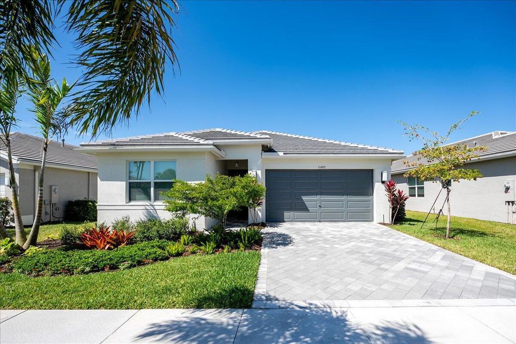 Photo of 11682 SW Oceanus Boulevard, Port Saint Lucie, FL 34987 (MLS # R10970657)