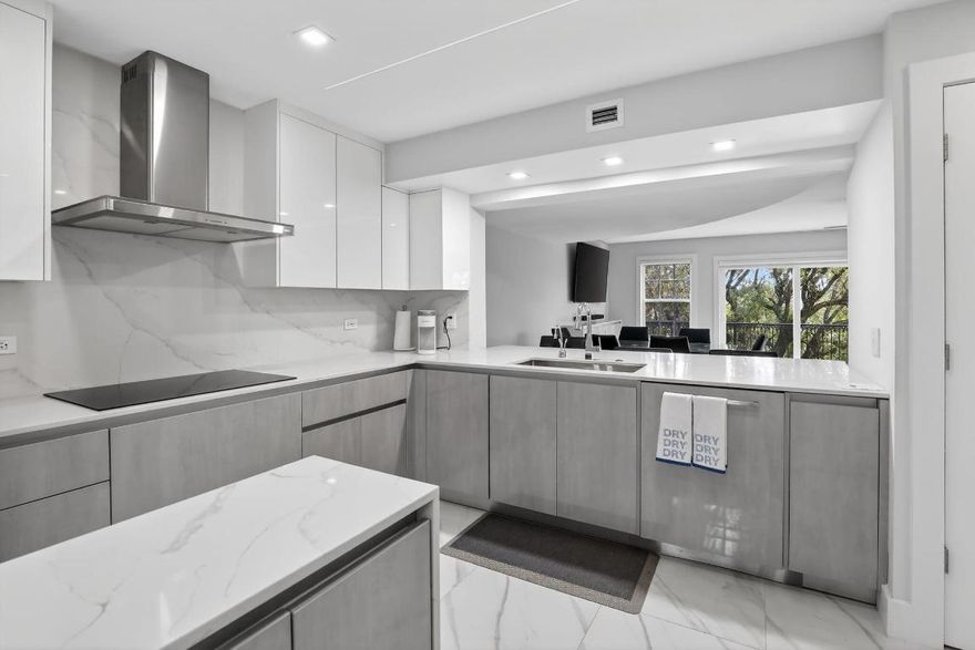 Live at the pinnacle of tennis excellence in Fort Lauderdale's legendary Lauderdale Tennis Club, a gated community in a prime central location. This luxurious, fully renovated 3-bedroom, 2.5-bath, two-story condo blends luxury and comfort. No expense was spared in this renovation, featuring a state-of-the-art kitchen with Bosch appliances, custom cabinetry, and a large pantry. Porcelain tile flooring throughout, generous closet space, and an in-unit LG washer and dryer add both style and peace of mind.

The beautiful spiral staircase connects the living room and kitchen with the bedrooms upstairs. The home offers a functional layout with the living area downstairs and all three bedrooms upstairs, including a primary suite with an elegant walk-in closet. Enjoy the ease of an elevator servicing both levels and relax on your private balcony with downtown skyline views.

Lauderdale Tennis Club is a manned gated community east of I-95, just minutes from Wilton Manors, downtown Fort Lauderdale, and the beach. Each building within the community is named after a famous tennis player, reflecting the club's rich heritage. For more than three decades, LTC has been widely recognized within the tennis community for the exceptional concentration of top-rated players who proudly call Lauderdale Tennis Club home.

Ownership includes 2 memberships to LTC, featuring 24 tennis courts, pool, jacuzzi, gym, clubhouse, tiki bar, and banquet room. More than just tennis, this is a lifestyle. Live in secluded serenity, yet close to everything Fort Lauderdale has to offer. A rare opportunity to live a tennis lifestyle in a gated enclave near downtown and the beach.