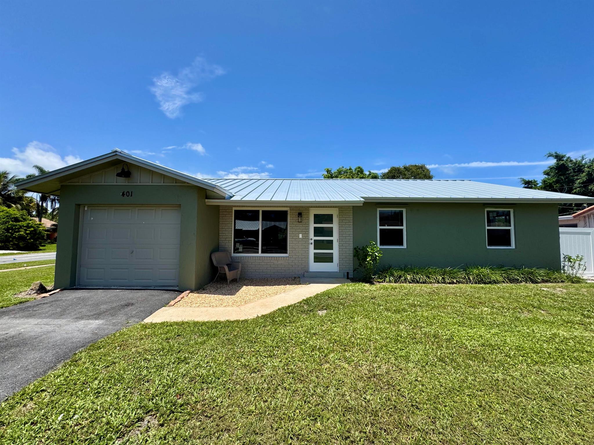This beautifully newly updated 3-bedroom, 2-bathroom single-family home offers the perfect blend of comfort, convenience, and coastal charm. Located just east of I-95 in a quiet, established neighborhood with no HOA, you're just minutes from the beach, shopping, dining, restaurants and Downtown Delray Beach. Step inside to discover a bright, open layout with tile flooring throughout, impact windows/doors, updated bathrooms and kitchen featuring quartz countertops plus new stainless-steel appliances. The floor plan offers privacy and functionality, with a spacious primary suite and ample closet space plus a dedicated laundry room off the one car garage. Outdoors, enjoy a fully fenced backyard, ideal for pets, play, or weekend BBQs. Zoned for top-rated schools and close to local parks and