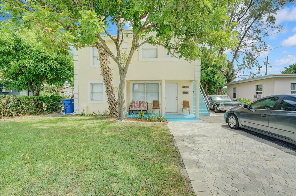 Photo of 1225 W 10th Street, Riviera Beach, FL 33404 (MLS # B26072141)