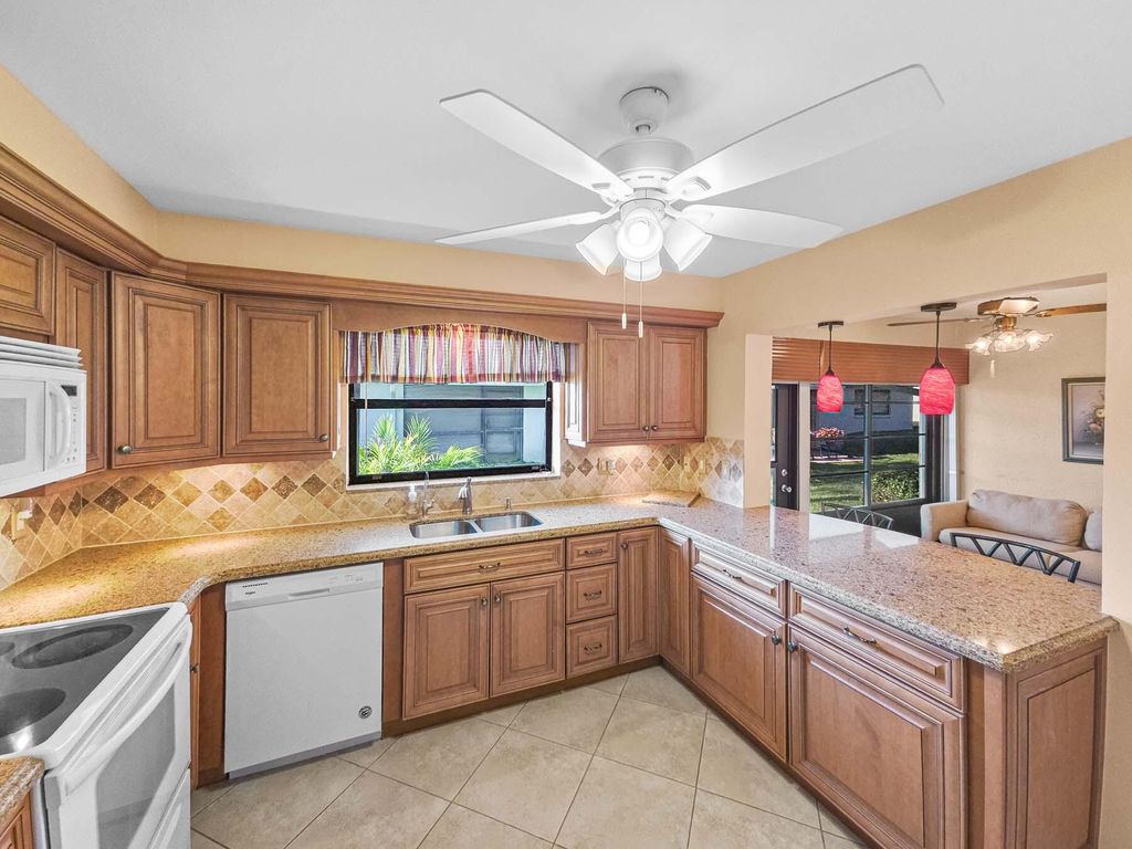 Photo of 9810 Tabebuia Tree Drive #B, Boynton Beach, FL 33436 (MLS # B26006310)