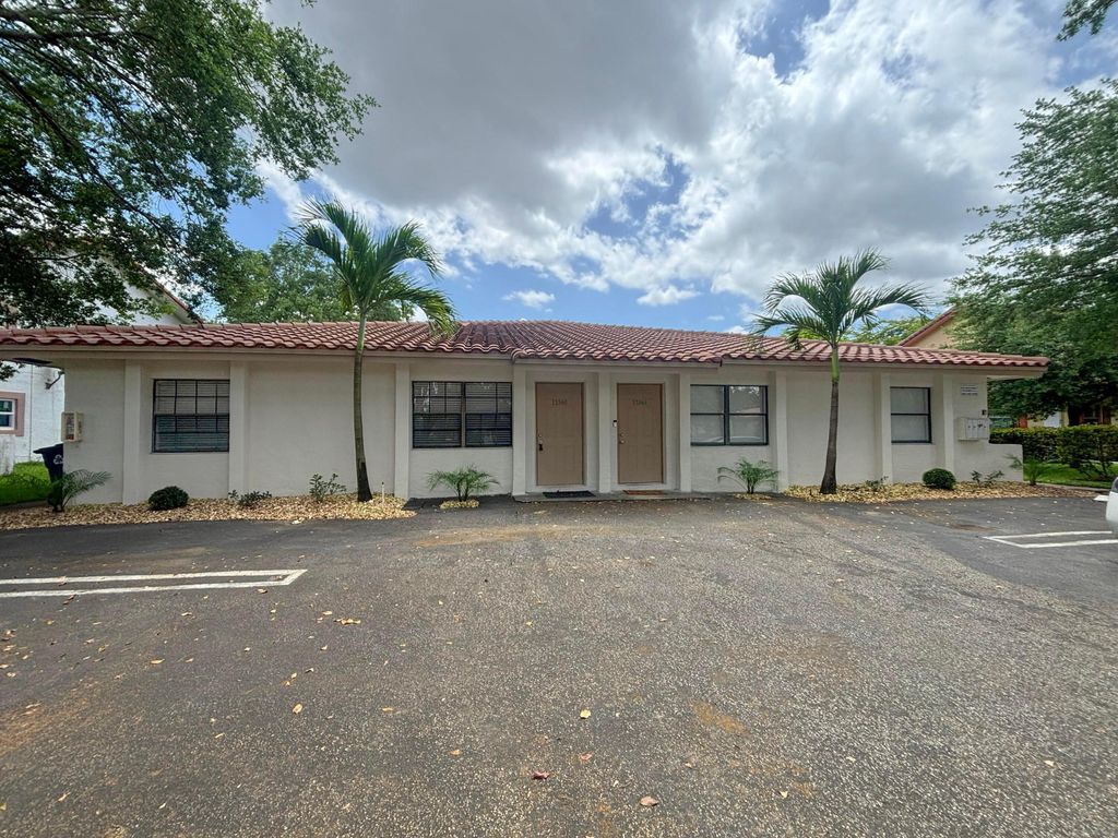 Photo of 11560 NW 37th Street #11560, Coral Springs, FL 33065 (MLS # B26018830)