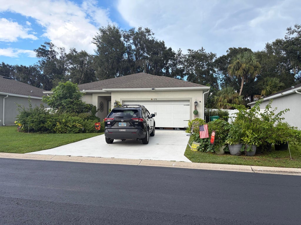 Photo of 5250 Oakland Lake Circle, Fort Pierce, FL 34951 (MLS # B26075758)