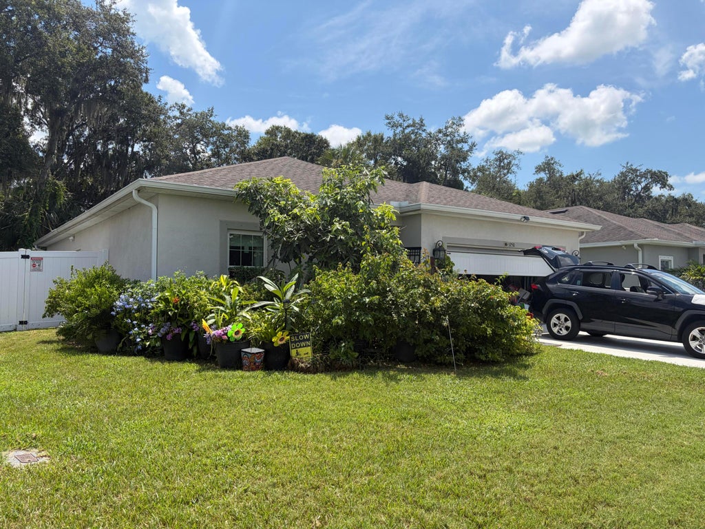 Photo of 5250 Oakland Lake Circle, Fort Pierce, FL 34951 (MLS # B26075758)