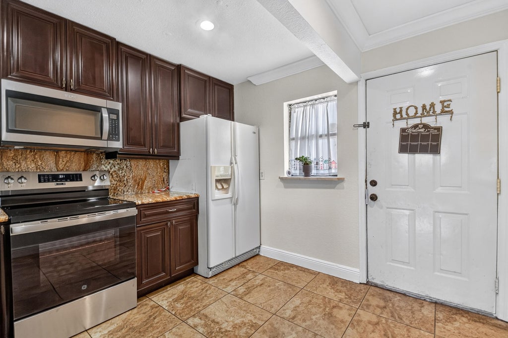 Photo of 617 IXORIA Avenue #23, Fort Pierce, FL 34982 (MLS # B26077123)