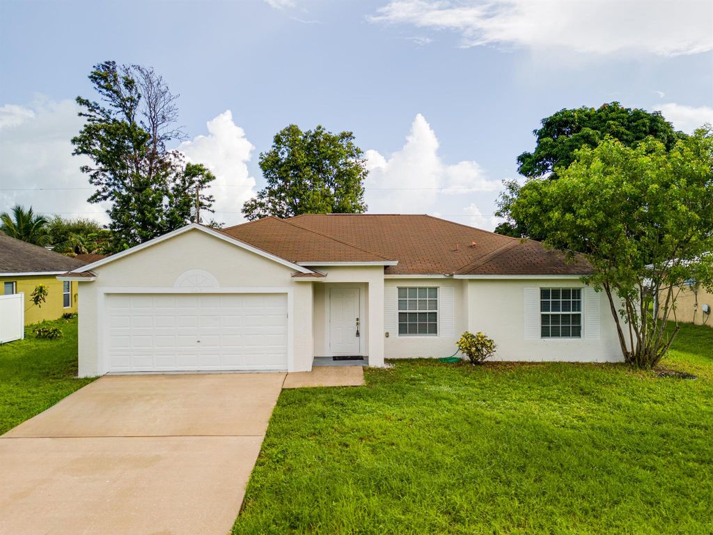 Photo of 443 SW Kabot Avenue, Port Saint Lucie, FL 34953 (MLS # R11009297)
