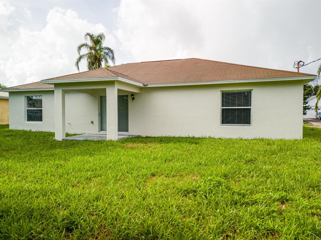 Photo of 443 SW Kabot Avenue, Port Saint Lucie, FL 34953 (MLS # R11009297)