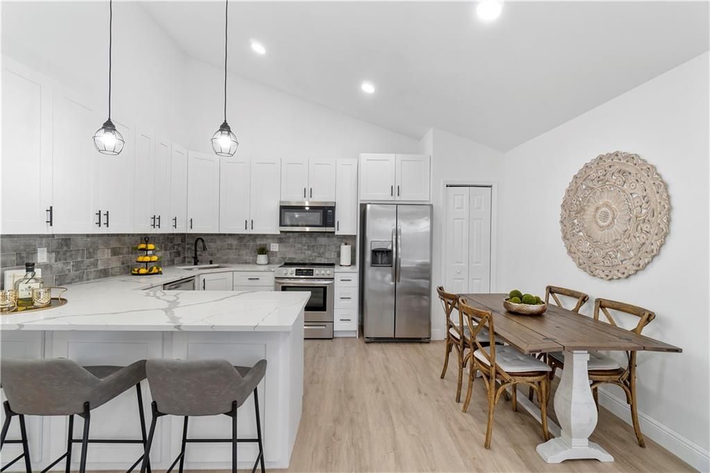 Photo of 9855 Boca Gardens Trl #D, Boca Raton, FL 33496 (MLS # F10328747)