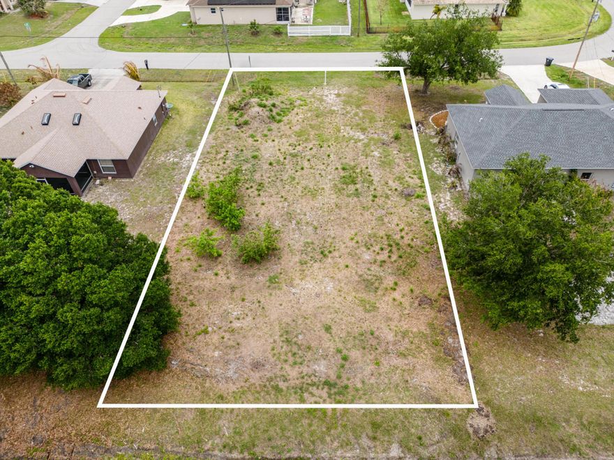 Build your next home with confidence on this ready-to-go lot in Port St. Lucie. This property is already cleared and has water connected, saving you time and upfront costs. Even better, the lot comes with city-approved plans for a 4-bedroom, 3-bathroom home offering 2,260 sq ft under air, allowing you to move forward with construction without the delays of design and approvals. Whether you are an end user ready to build or an investor looking for your next project, this is a rare opportunity to secure a prepared homesite in a growing area of Port St. Lucie.