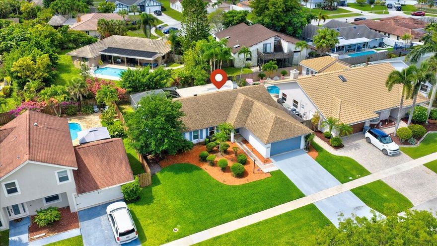 Seller preferred lender credit up to $4k available** This home in Cimarron of Loggers' Run is priced to sell fast! ! This single-story home features a stacked floor plan with vaulted ceilings w/a unique sunken fireplace. The spacious primary suite offers direct access to the expansive screened lanai, perfect for enjoying Florida evenings. Fenced on all sides, your private backyard is bursting with opportunities & future memories await Plenty of room to add your dream pool, hot tub, tiki hut, fire pit, etc. Enjoy peace of mind: CBS construction, newer roof & AC, w/impact windows & doors. Loggers' Run offers incredible amenities including parks, trails, and top-rated schools right in the neighborhood, all with a remarkably low HOA fee. This is the best deal in W. Boca. Move fast!