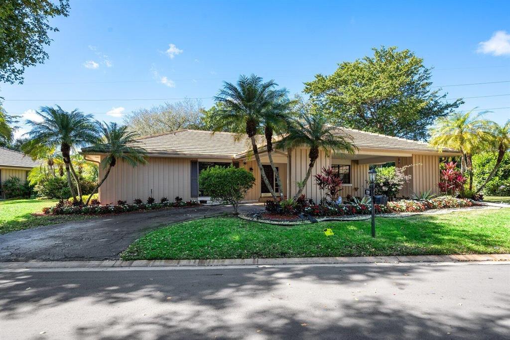 Stunning Atlantis Villa, now available! Perfect 2 bedroom villa PLUS DEN floor plan has been completely remodeled. Over 2,000 living sq feet, open floor plan provides the comfort of a home without the yard or pool maintenance. The Muirfield Villa community offers lush trees, canopying each villa and private pool for its Villa owners. Pull right inside your covered carport with private driveway. Inside, modern Chef's kitchen, Samsung appliances w/ smart connect technology, gray cabinets, soft closings drawers, quartz counter and backsplash. Italian porcelain floors, crown molding, new baseboards, interior freshly painted. Both bathrooms have been updated with quartz countertops Calcutta, custom vanities, with beautiful floors and lighting. Modern fans in every room! New French doors to pati